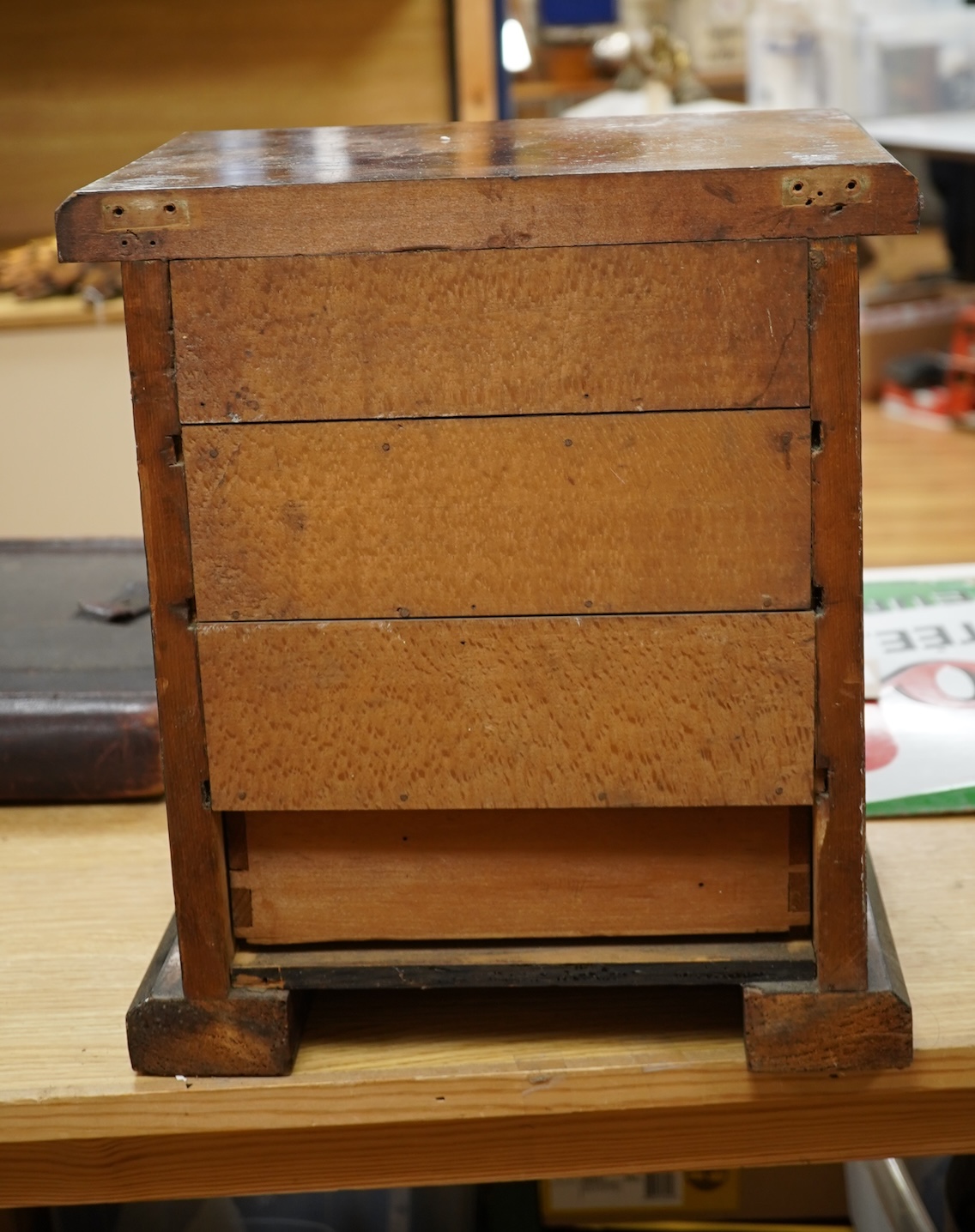 A Victorian walnut miniature two door tabletop cabinet/chest with two short and three long drawers inside. 32cm wide x 37cm high